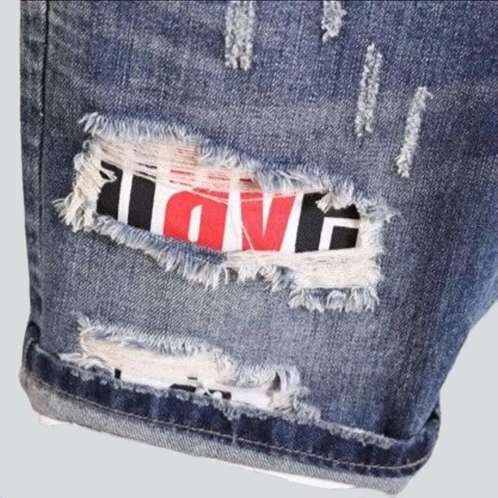 Inscribed patch distressed denim shorts